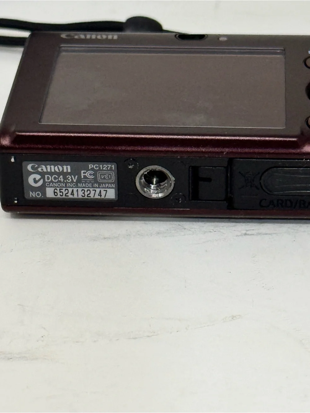 Canon Digital Camera with Charger and Tan Carry Case - Red Camera